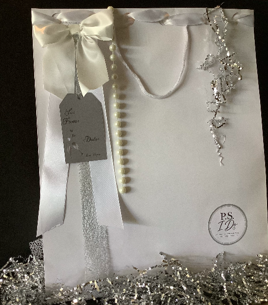 White P.S. I Do signature delivery bag with pearls and satin bow