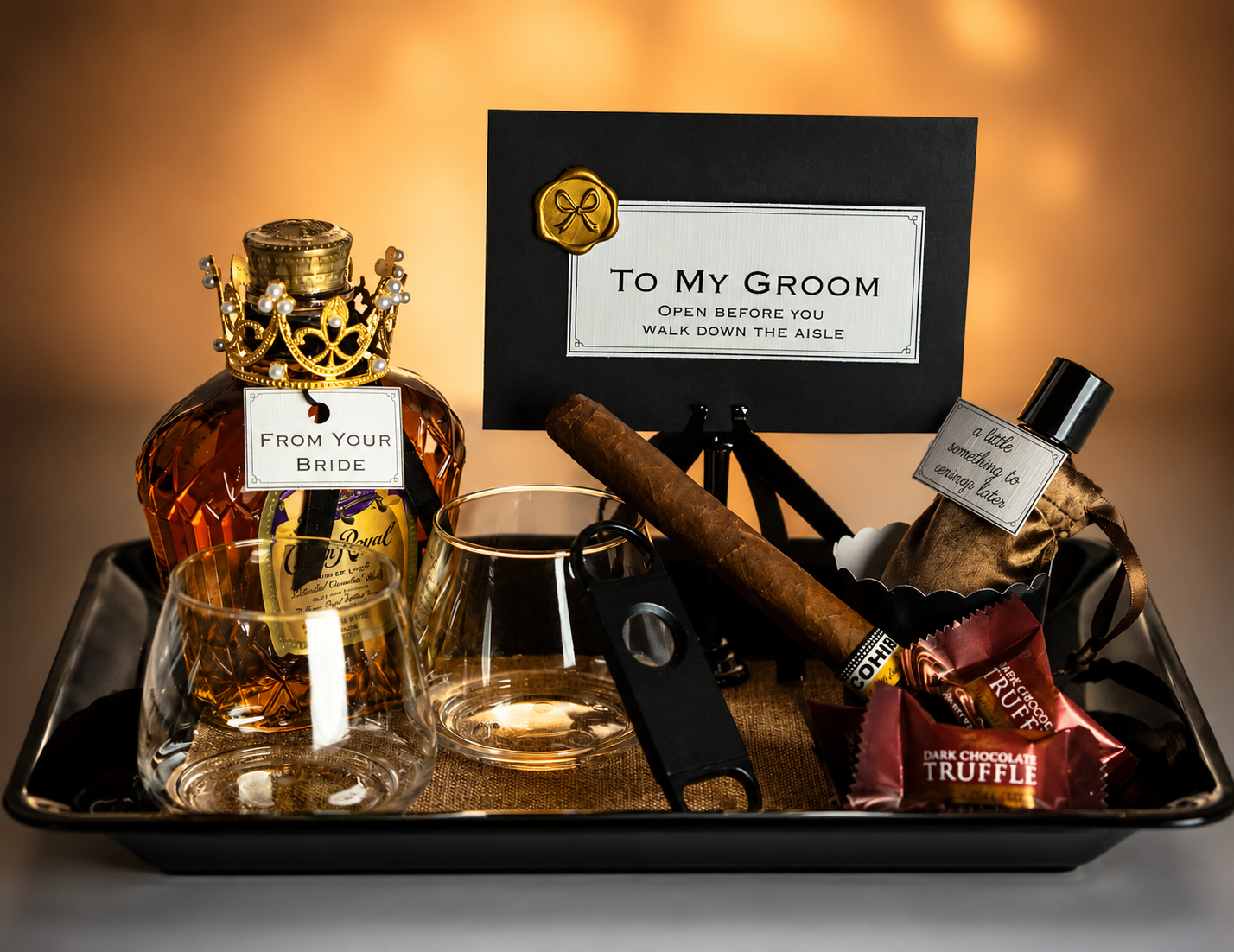 Black and gold groom keepsake tray with whiskey, cigar, and personal card