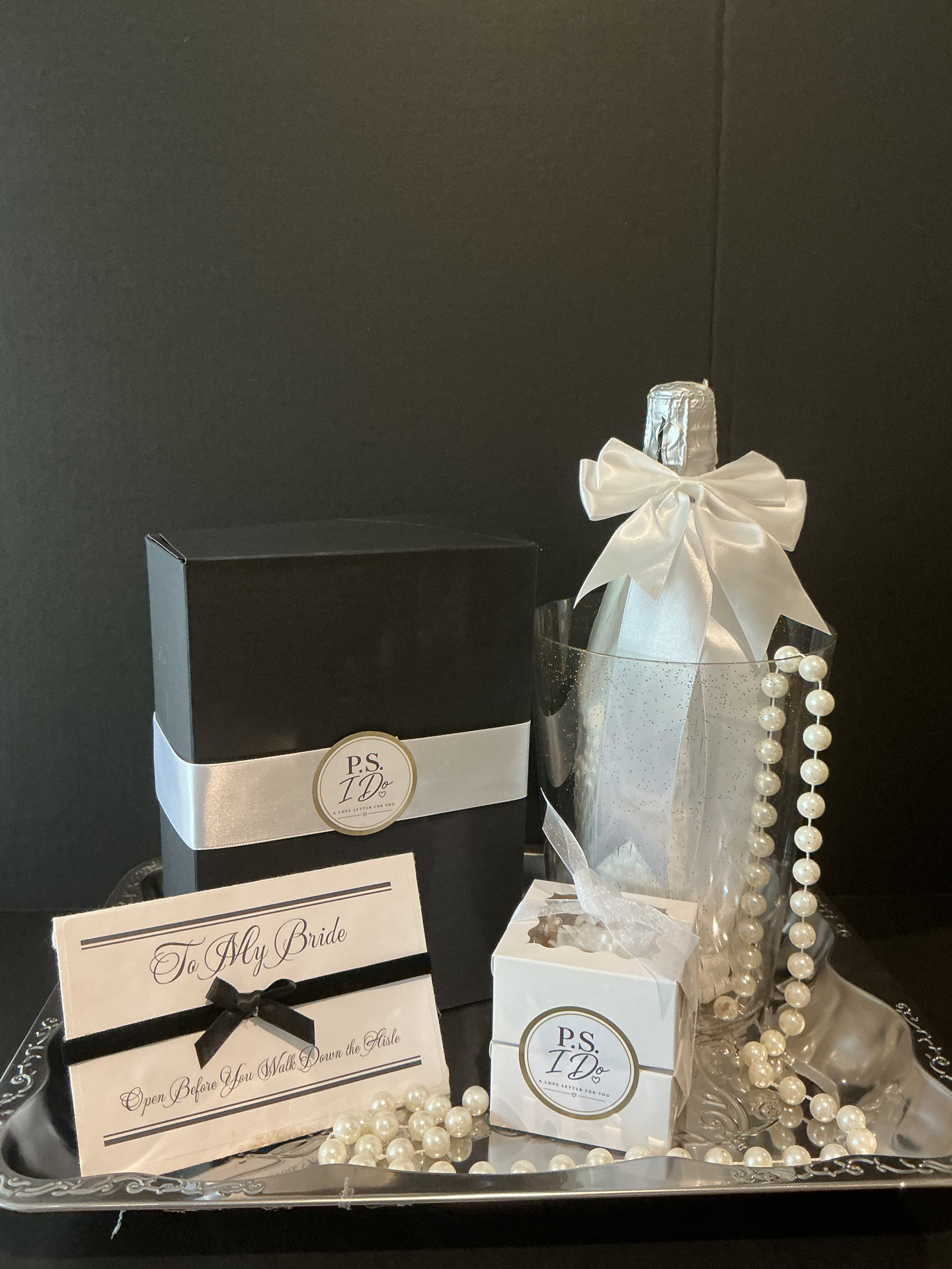 Signature bridal presentation with personal message, ice bucket, flutes, candy and decor
