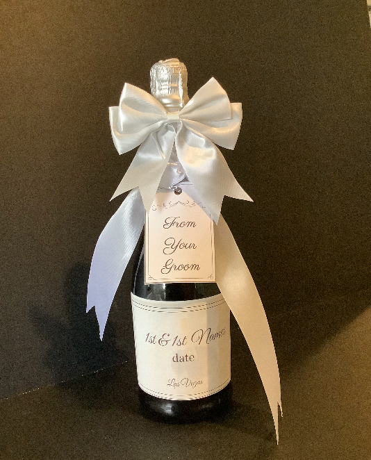 Personalized champagne bottle with satin bow
