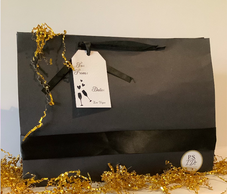 Black P.S. I Do gift bag with gold tinsel and custom tag
